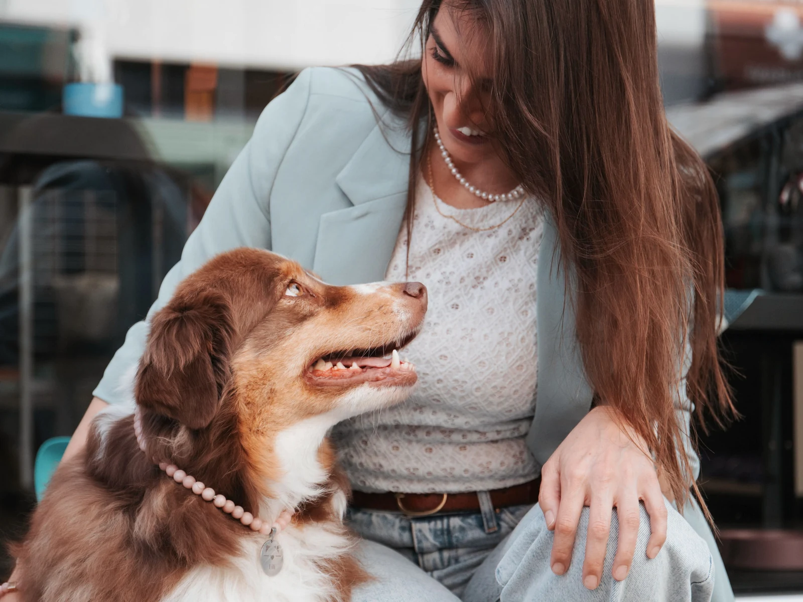 Dr. Bia Mori sharing a warm moment with a dog